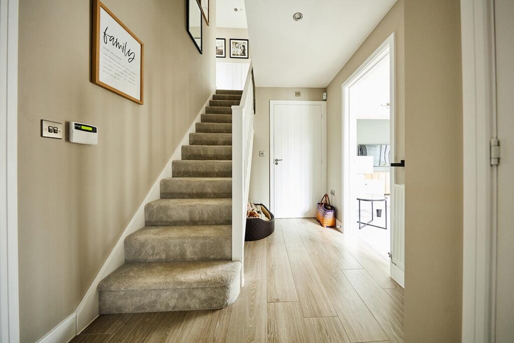 Lounge and kitchen to either side of the hall