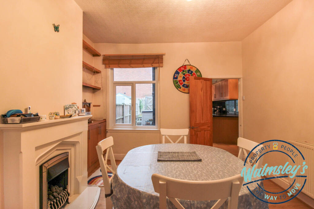 Dining area &amp; kitchen beyond