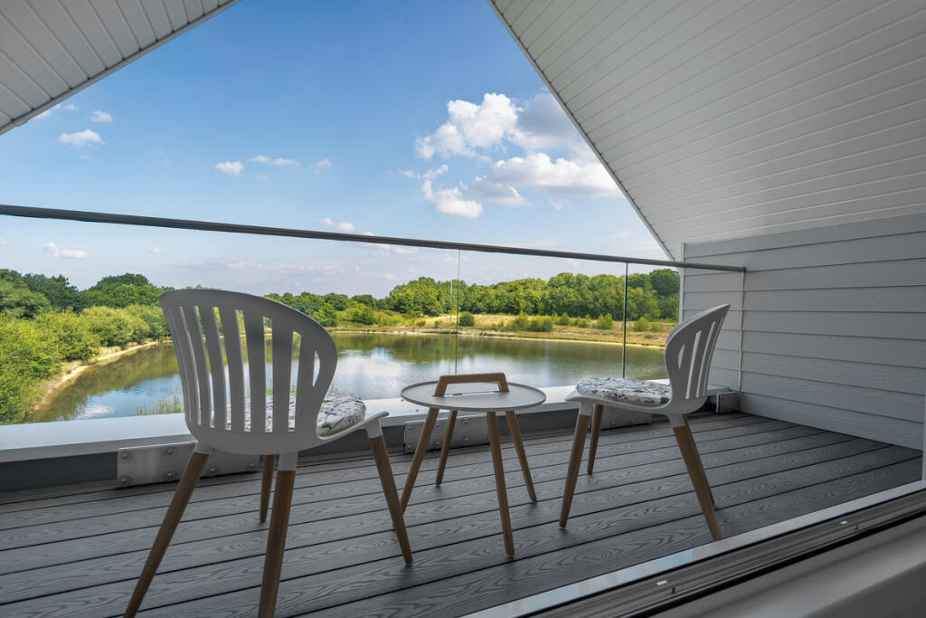 Master bedroom balcony with stunning views over the lake