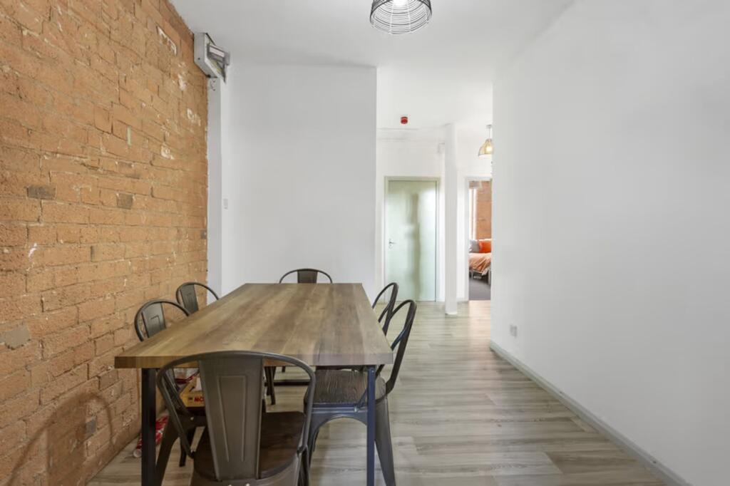 A spacious and inviting living room with a styl...