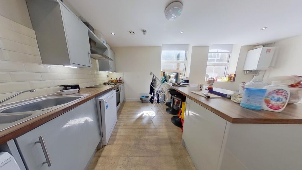 Bright and modern kitchen with ample countertop...