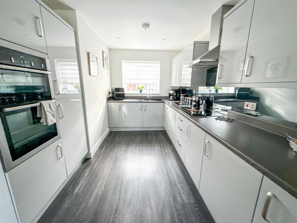 ALTERNATE VIEW OF KITCHEN AREA
