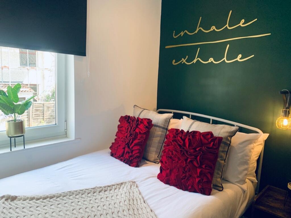 A stylish and inviting double bedroom featuring...