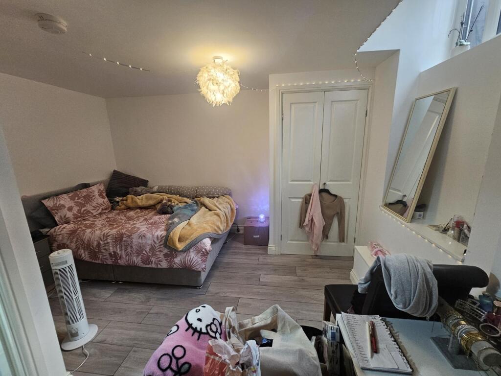 Cozy and inviting master bedroom featuring a co...