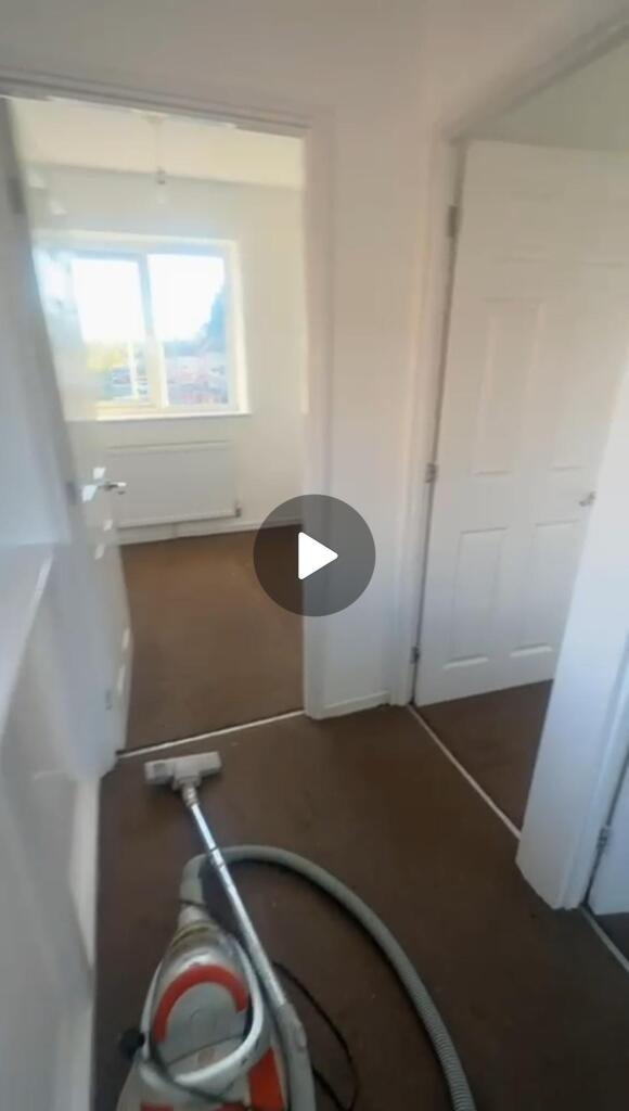 A spacious bathroom with a large window that al...