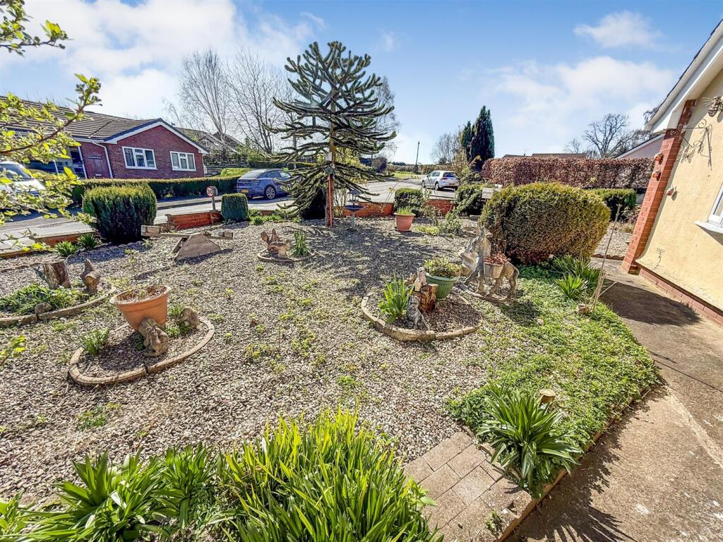 To the front and Side of the Property