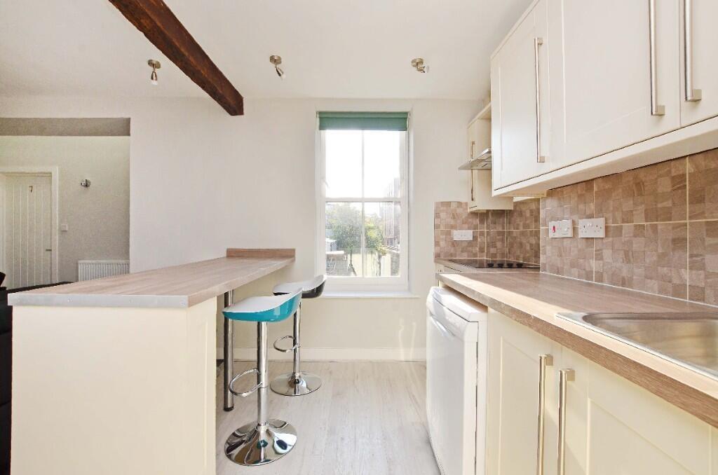 Bright and clean kitchen with neutral cabinetry...