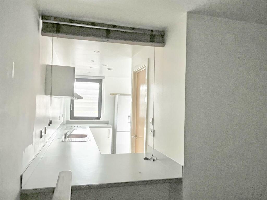 Bedroom through to kitchen area