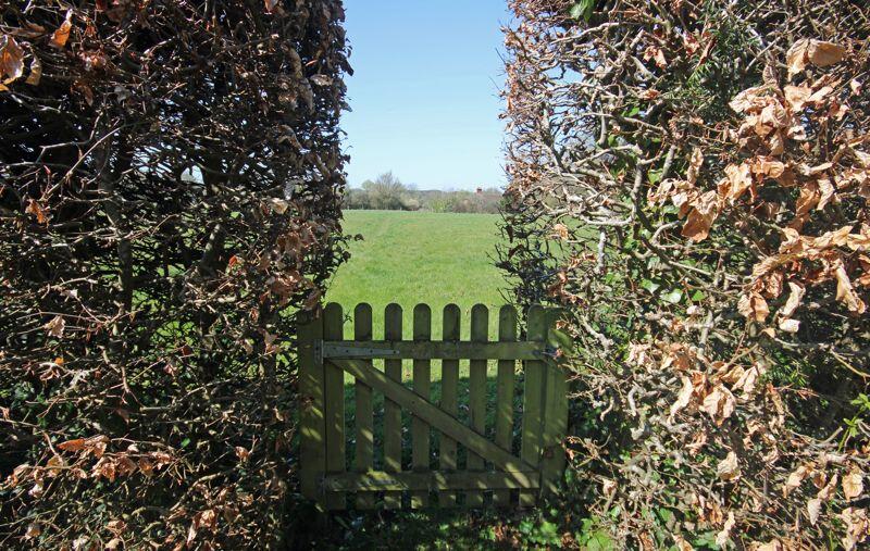 Gate to footpath behind property
