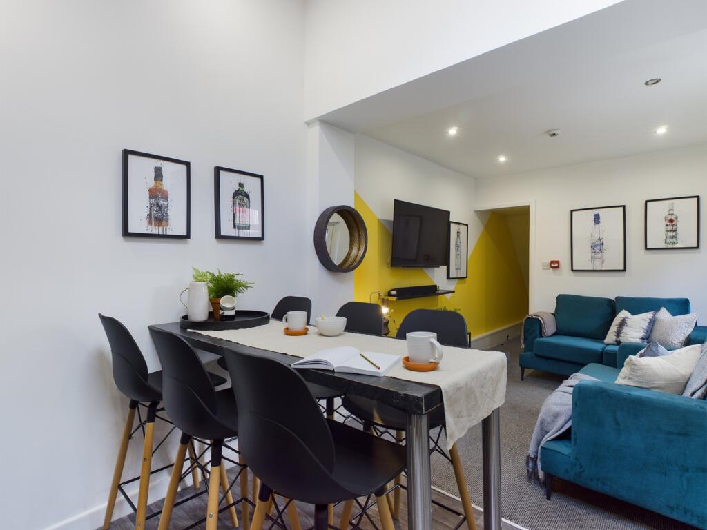 A spacious and stylish modern living room, perf...