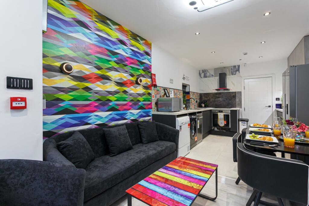 A vibrant and modern kitchen with stylish decor...