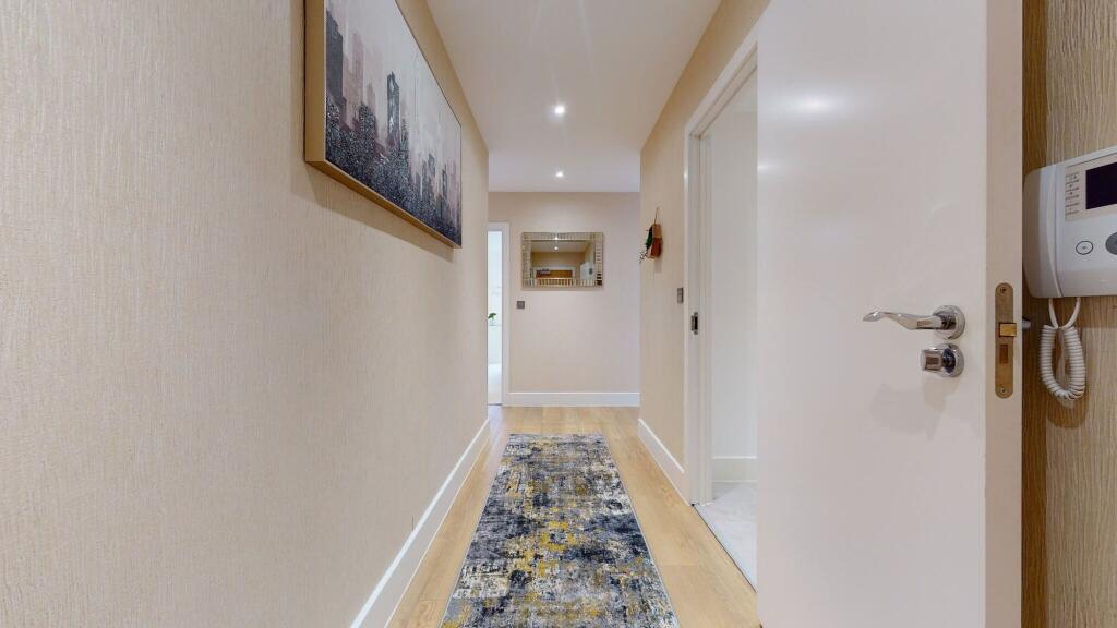 A clean and well-maintained hallway featuring m...