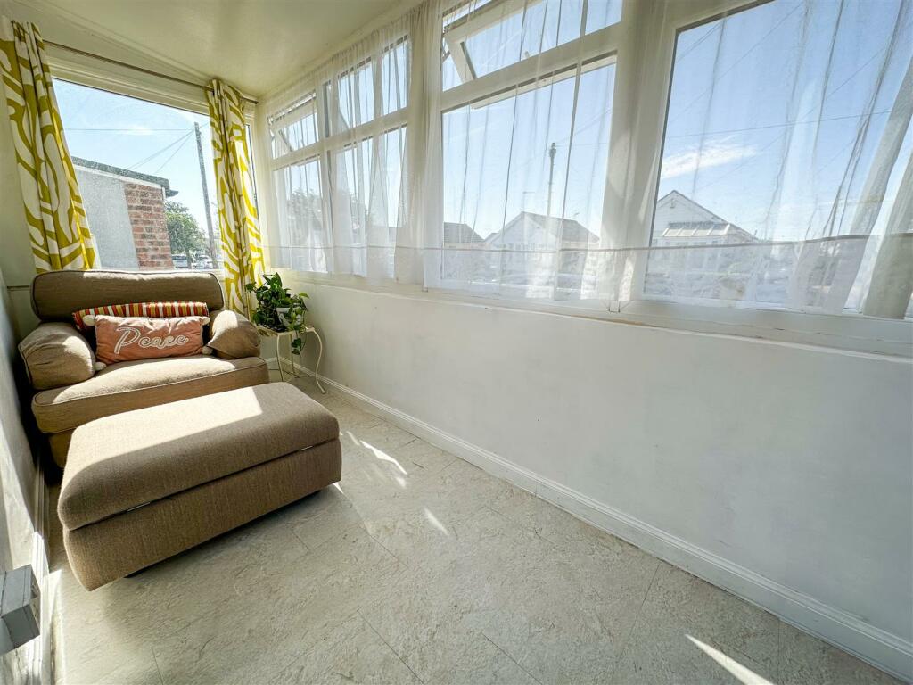 ENTRANCE PORCH/FRONT SUN LOUNGE