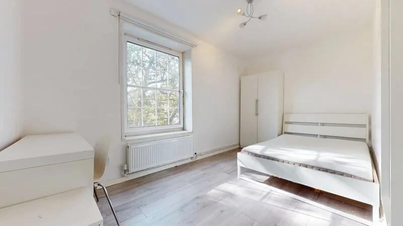 Bright and airy double bedroom featuring a larg...