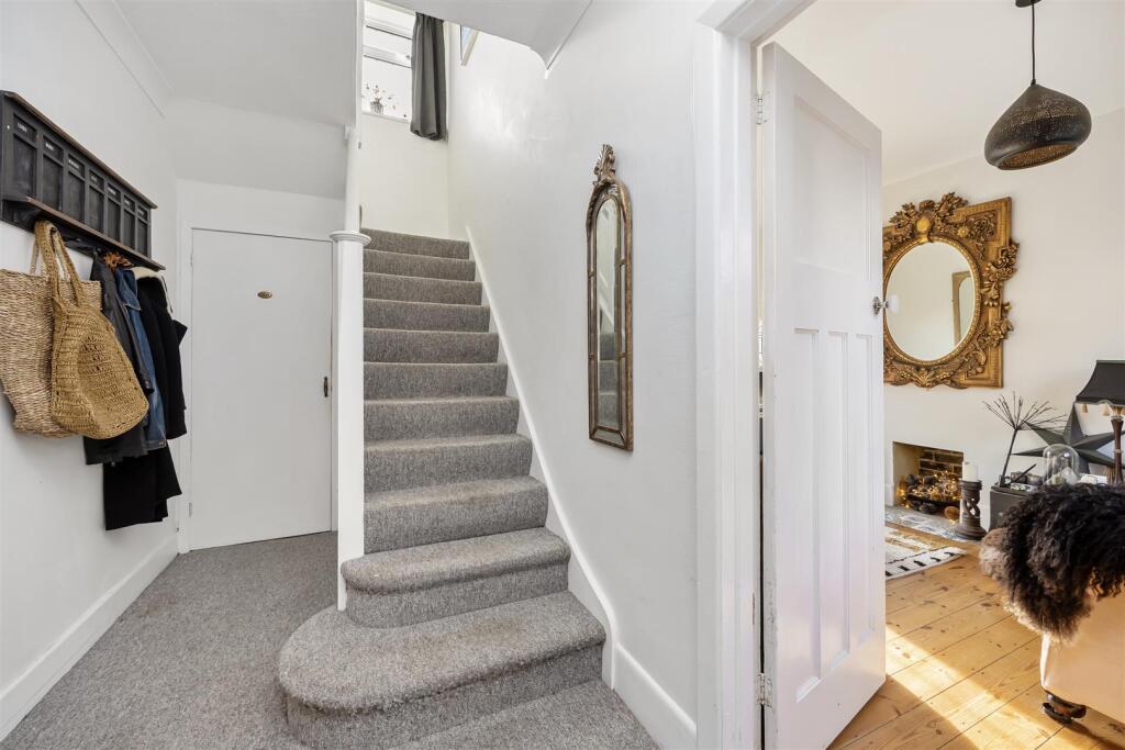 Stairs rising to First Floor