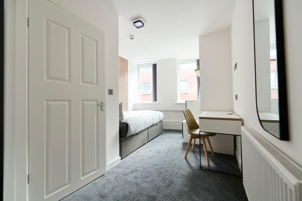 Bright and clean single toilet room with modern...