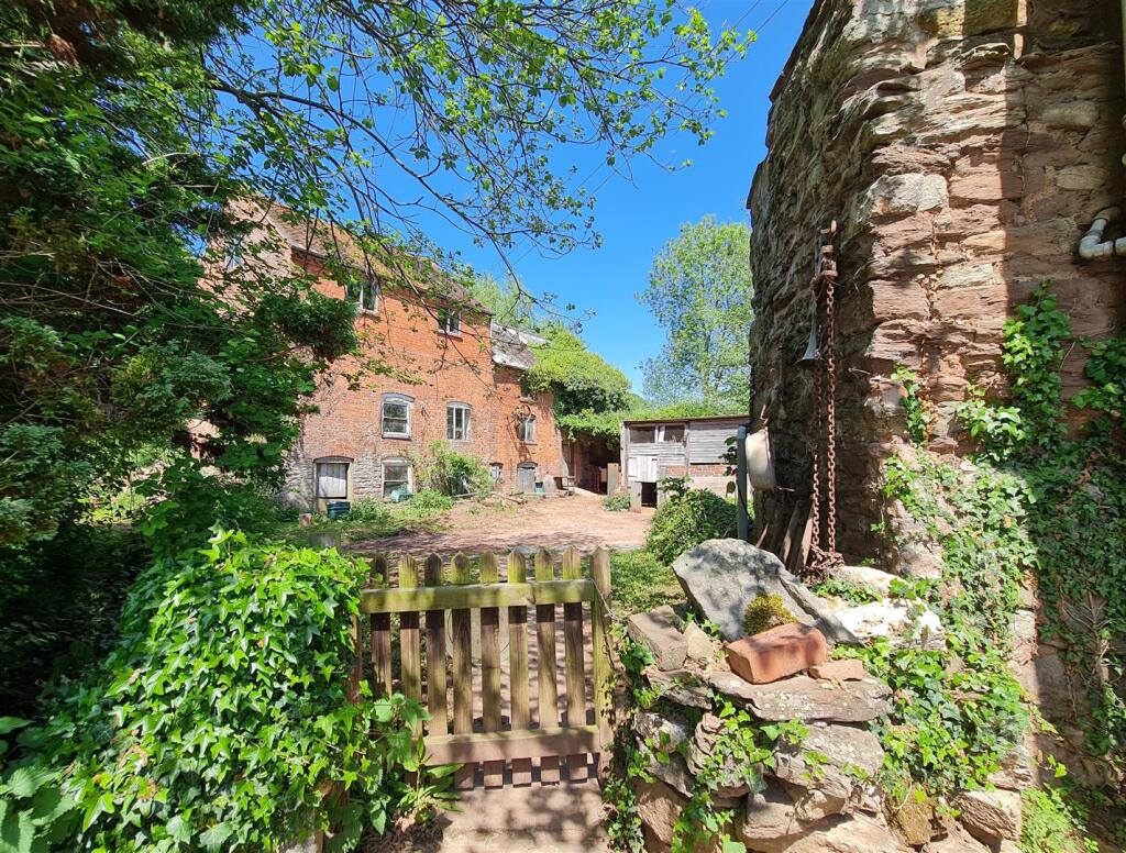 Mill building from garden gate.jpg