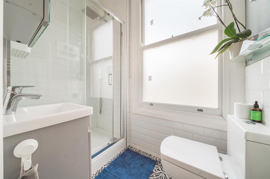 Modern fitted shower room combined W.C