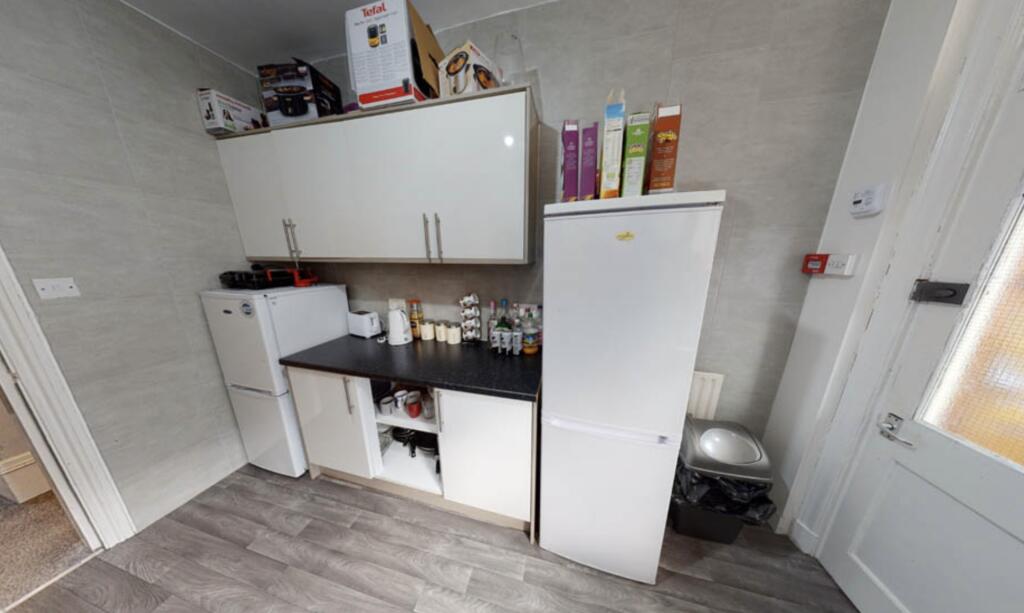 A well-maintained kitchen area featuring a clea...