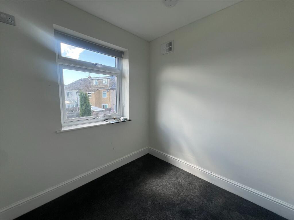 A clean and well-maintained small room with a w...