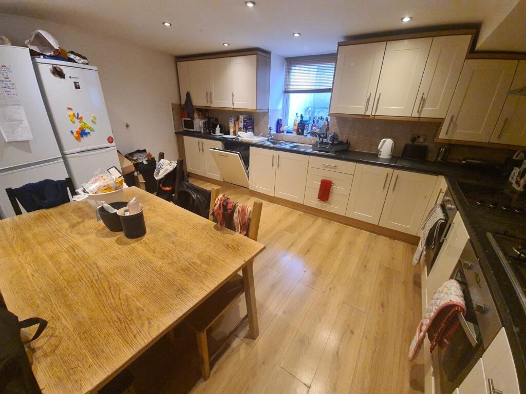 A spacious and well-equipped kitchen featuring ...