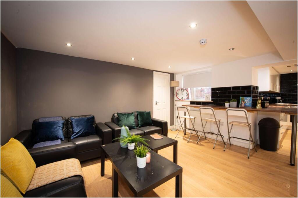 A modern, well-maintained living room with comf...
