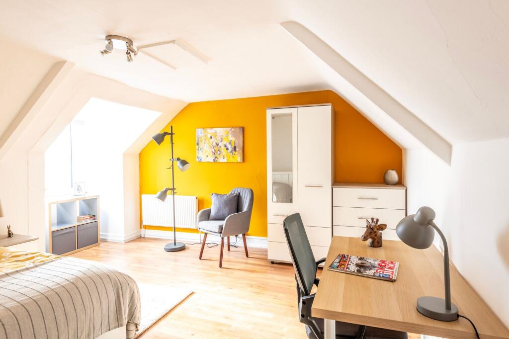Bright and inviting double bedroom featuring a ...