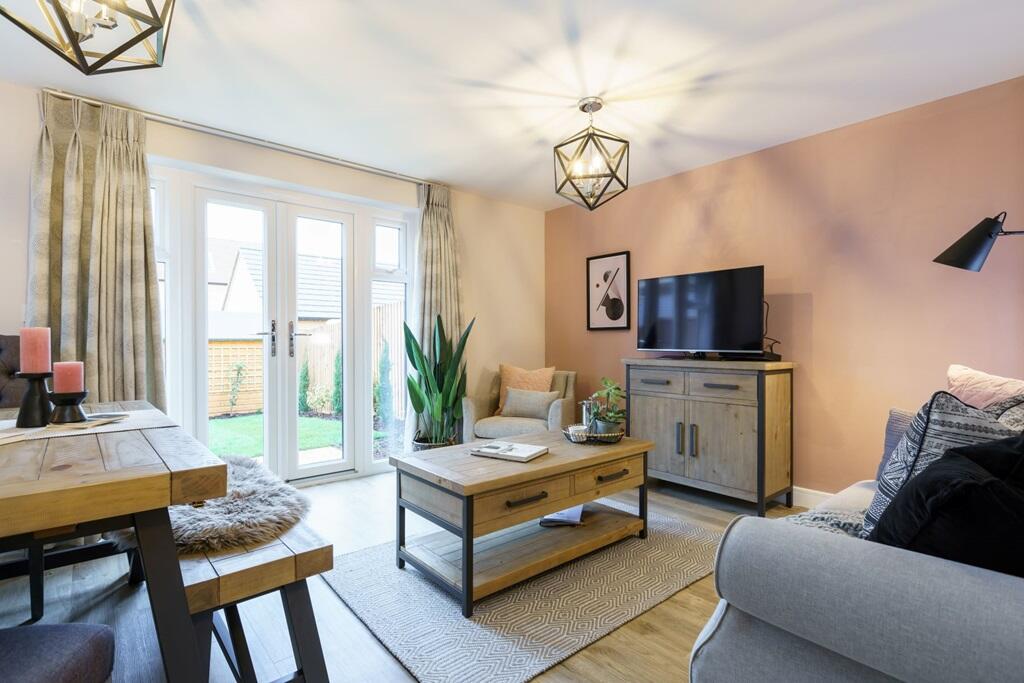 Double doors lead from a spacious lounge to the garden