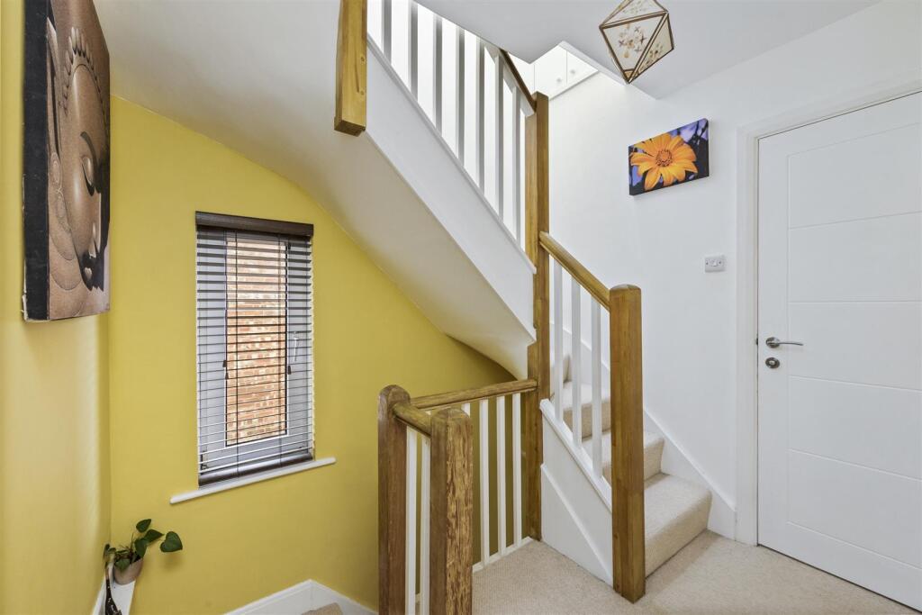 Stairs rising to Second Floor