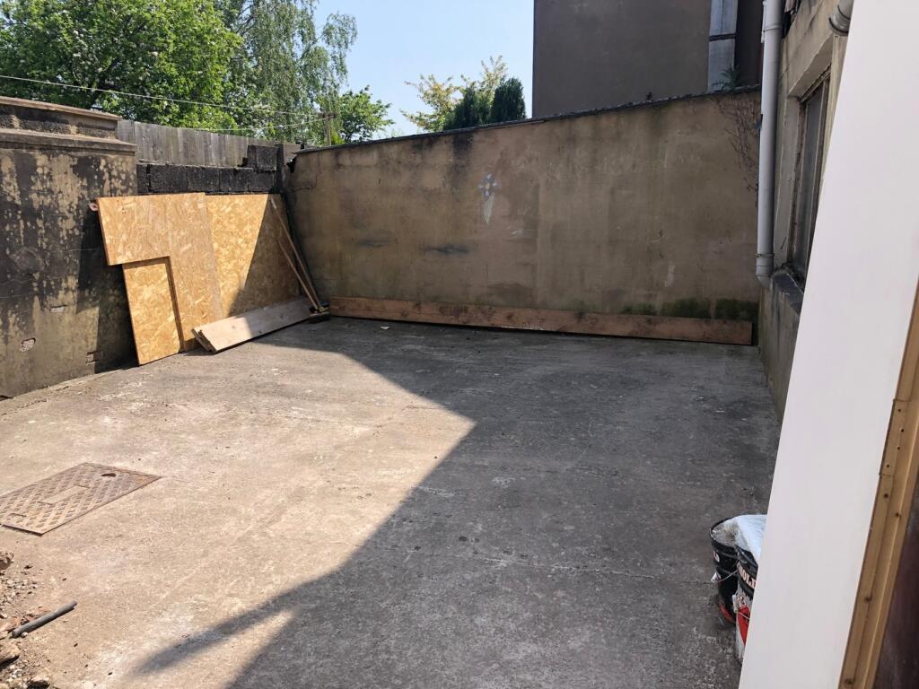 A spacious outdoor area with potential for cust...