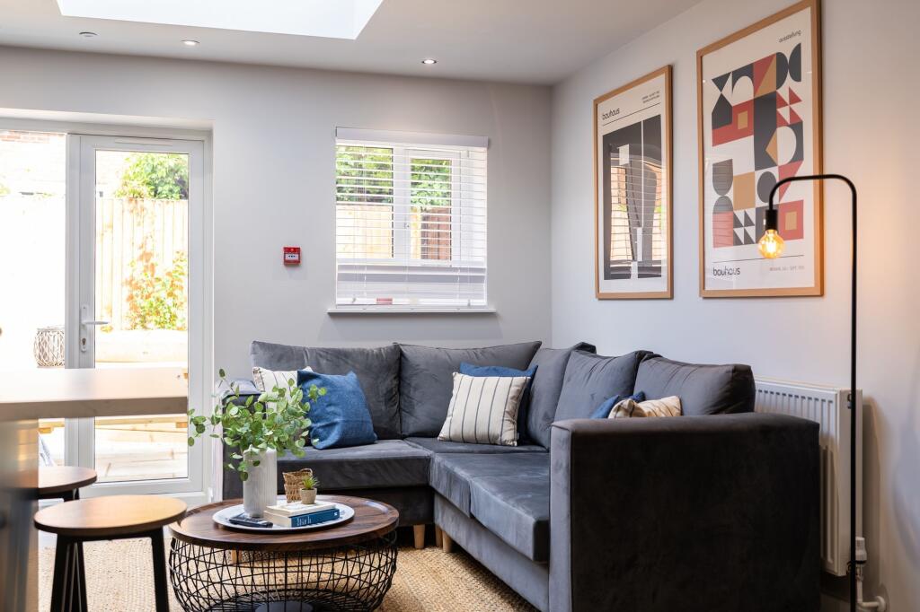Bright and welcoming living room featuring a co...