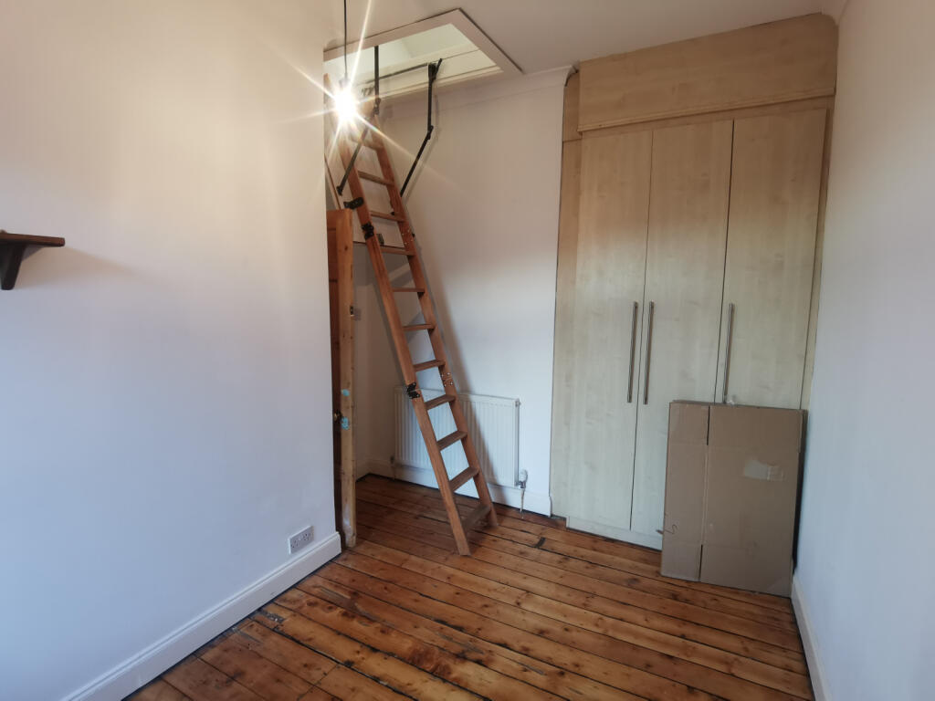 Bedroom Two, Ladders Leading To Attic