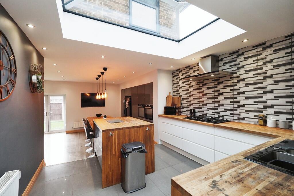 Modern Kitchen with Skylight and Plenty of storage and workspace