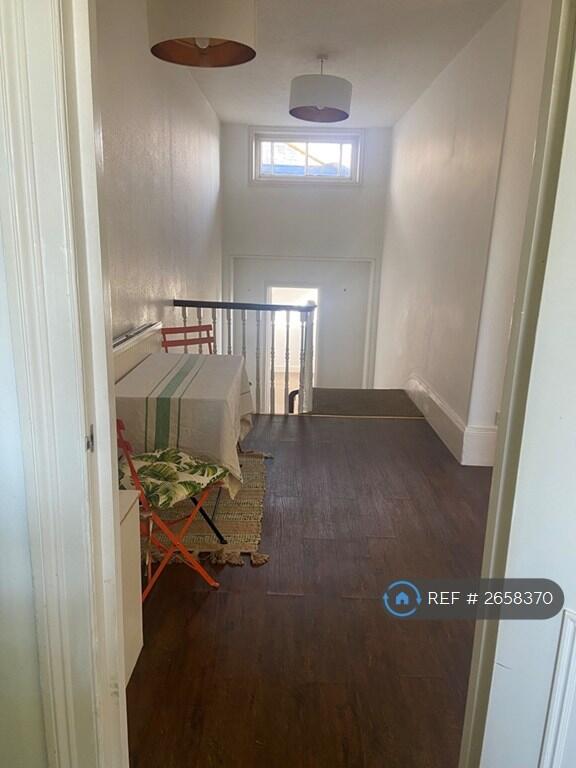 Light Hallway Used For Dining Or Office Space