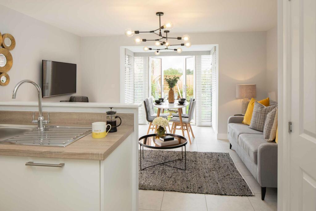 Greenwood internal show home kitchen and family room with a glazed bay, DWH, orchard green, kingsbro