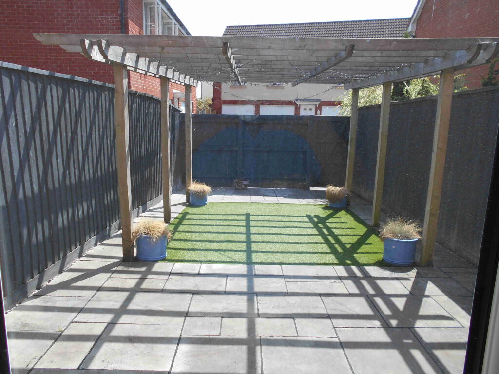 Garden leading to Garage