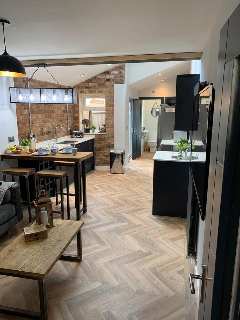 Modern and stylish kitchen featuring sleek blac...