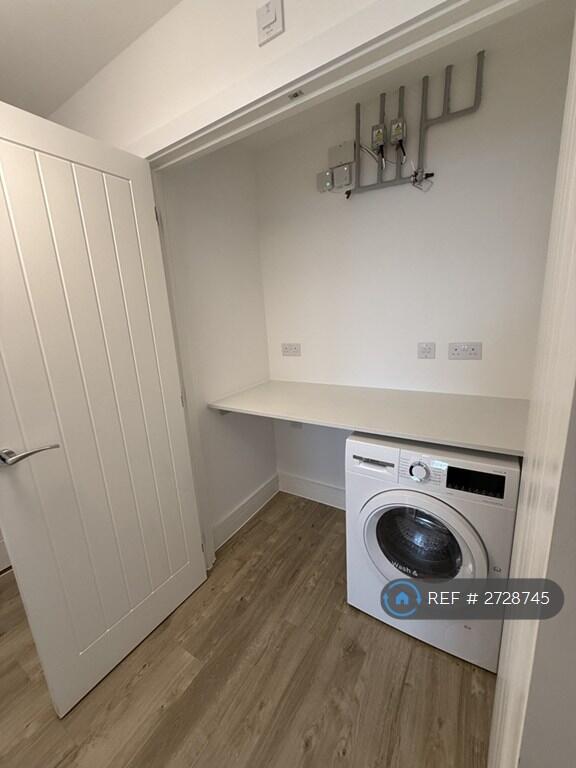 Big Utility Storage Cupboard In Hallway