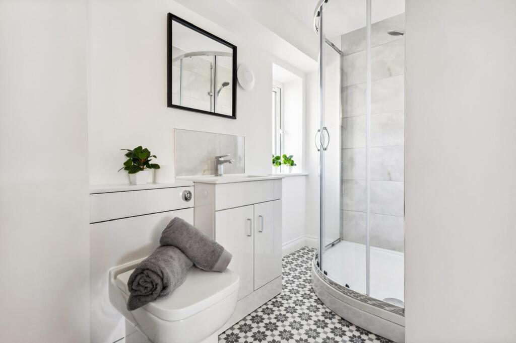 A beautifully designed bathroom featuring a mod...
