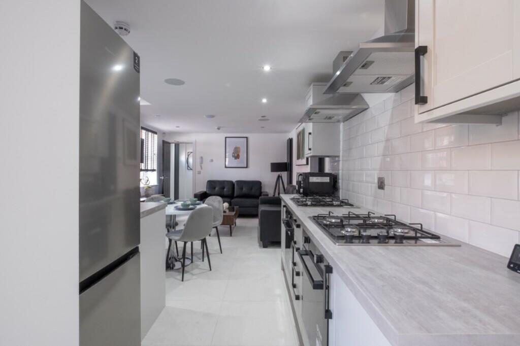 Stylish kitchen featuring modern appliances and...