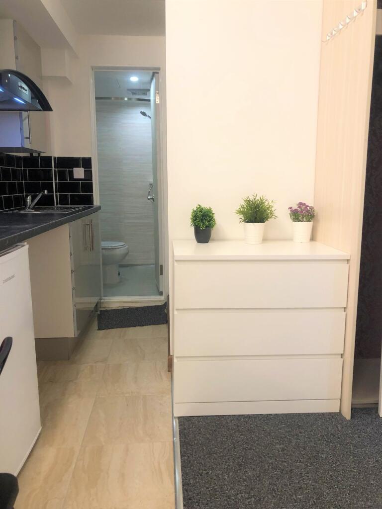 Bright and tidy kitchen space featuring modern ...