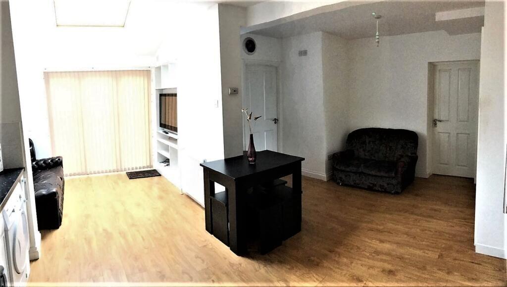 Bright and inviting living room featuring a coz...