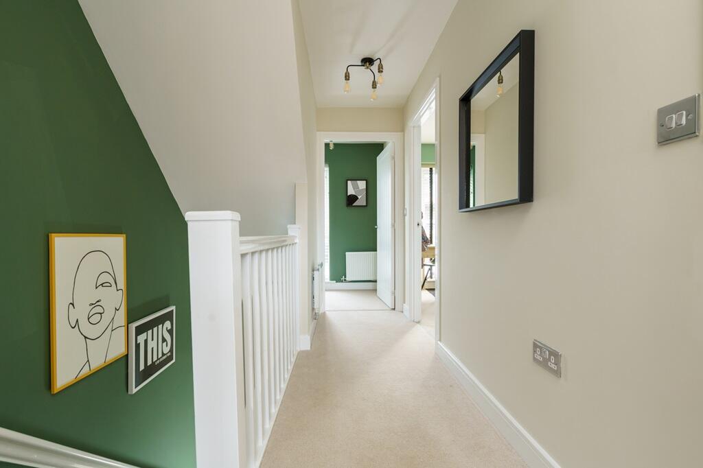 Bright and welcoming landing connecting rooms seamlessly