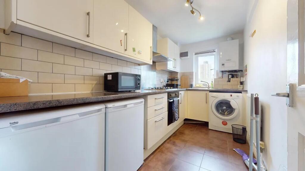 Modern kitchen featuring ample countertop space...