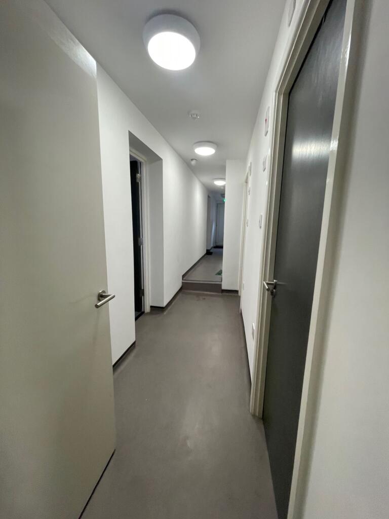 Spacious and well-lit hallway featuring modern ...