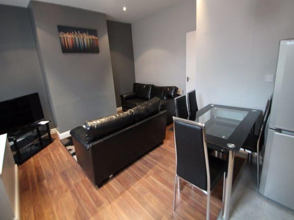 Contemporary living room featuring sleek black ...