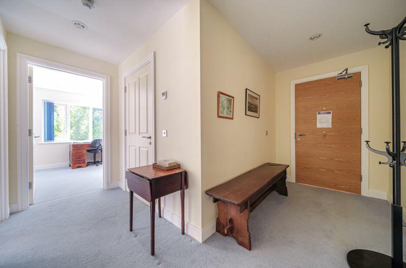 Entrance hall with storage cupboards