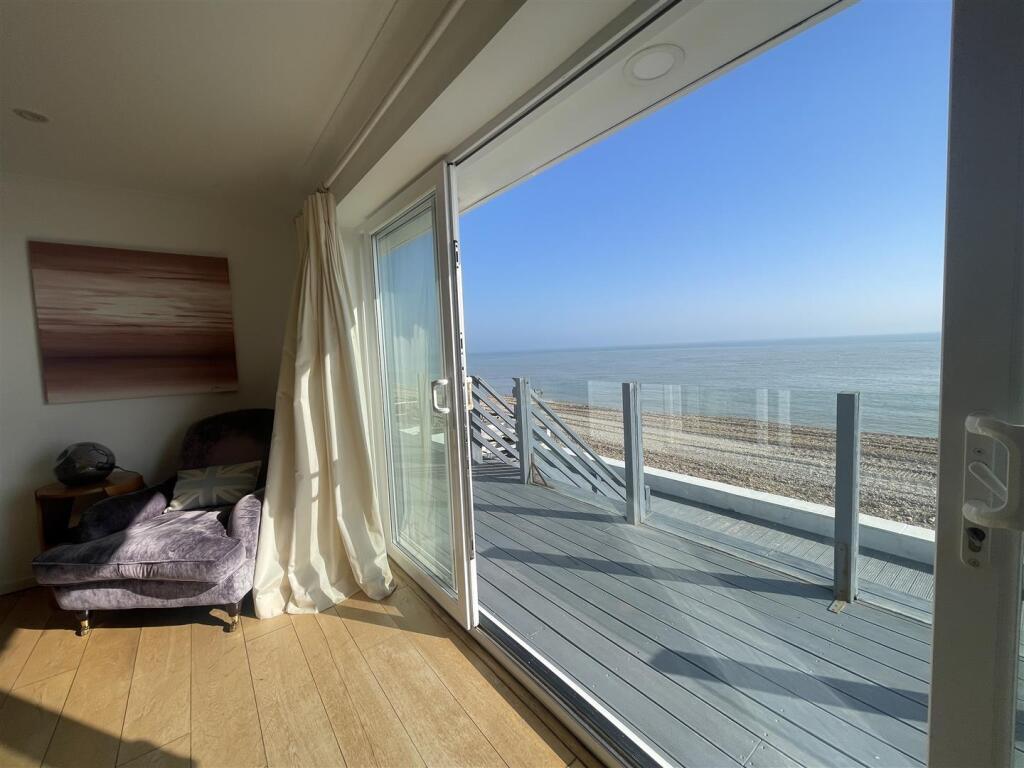 Keelan lounge window to deck and sea.JPG