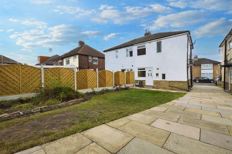 Bright and well-maintained exterior of a semi-d...