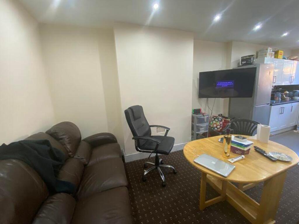 A spacious and inviting living room with comfor...